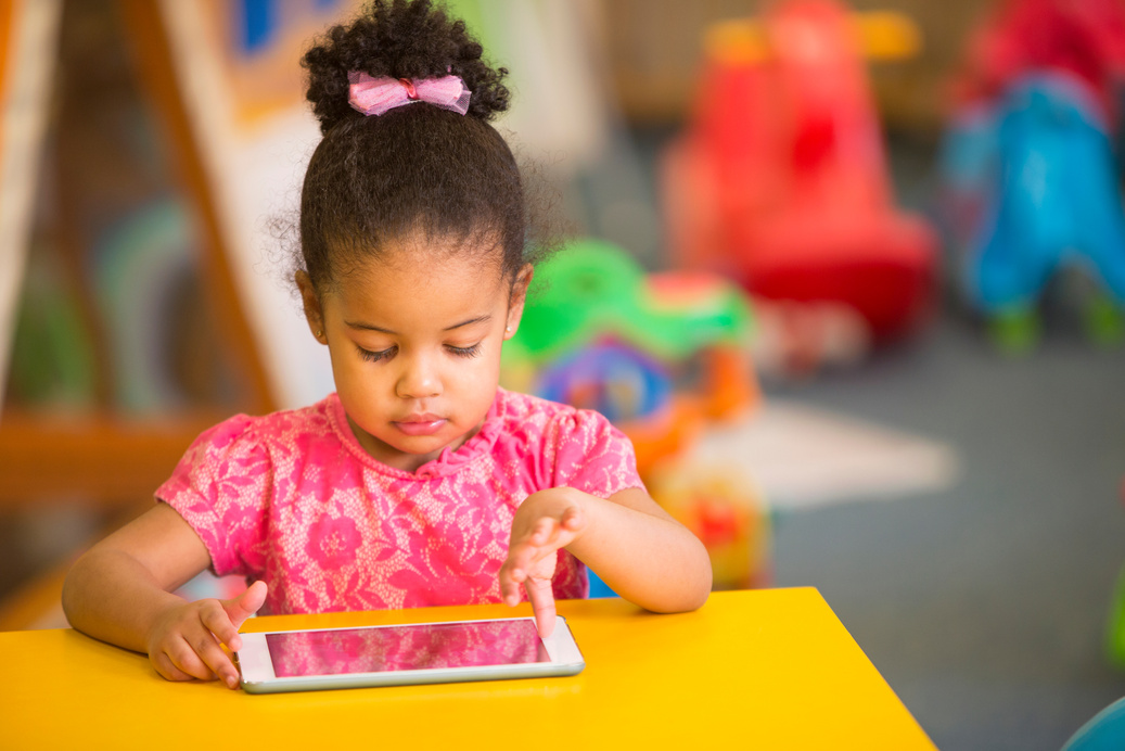 Preschool Child using Digital Tablet